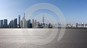 Empty road surface floor with city landmark buildings of panorama