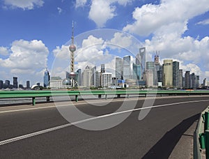 Empty road surface with shanghai bund city buildings