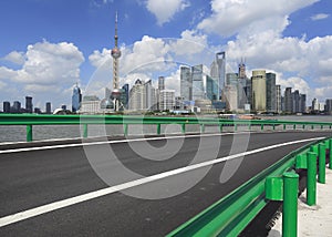 Empty road surface with shanghai bund city buildings