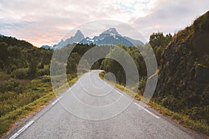 Empty road to the mountains landscape in Norway