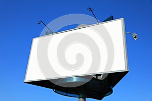 Empty roadside billboards at blue sky