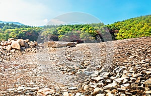 Empty rocky pavement and clean and comfortable autumn natural landscape.