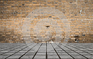 Empty room with bricks wall and tiled floor