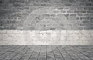 Empty room with bricks wall and tiled floor