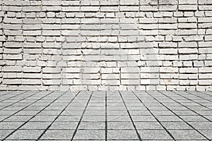 Empty room with bricks wall and tiled floor