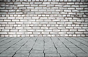 Empty room with bricks wall and tiled floor