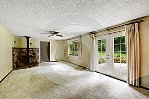 Empty room with carpet floor and fireplace