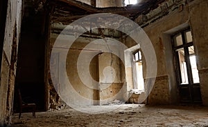 Empty room with chair in old ruined abandoned building,Ukraine