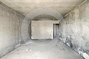 Empty room with concrete walls, floor and ceiling, no plaster