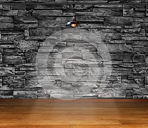 Empty room - granite stone decorative brick wall with lamp and laminate flooring interior background, interior template for
