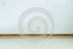 Empty room interior, white tile floor and white mortar wall