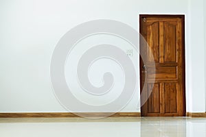 Empty room interior with wooden door