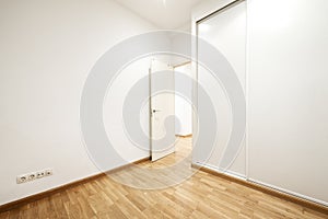 Empty room with large built-in wardrobe