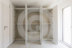 Empty room with large wardrobe photo