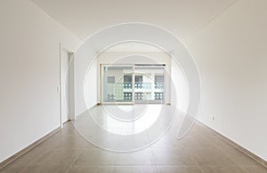 Empty room in a modern apartment with white walls, nobody in the scene