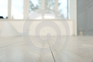 Empty room with new white laminated flooring, closeup