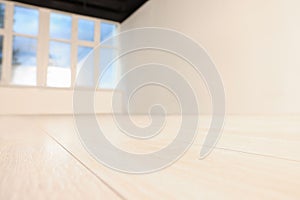 Empty room with new white laminated flooring, closeup