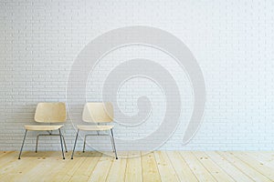 Empty room with two chair and white brick wall