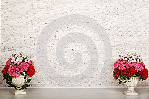 Empty room with white brick wall and beautiful flowers