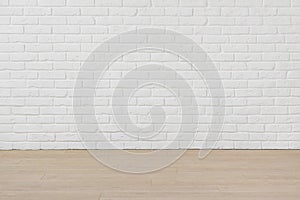 Empty room with white brick wall and laminated flooring board
