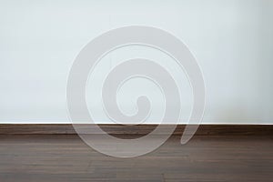 Empty room, white mortar wall background and wood laminate floor