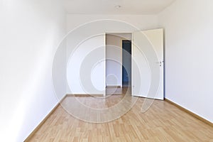 empty room white walls laminate flooring