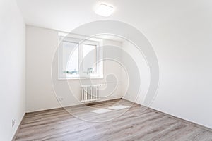 empty room with white walls and window in a new building, apartment for rent