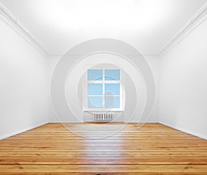 Empty room with window, wooden board floor in renovated flat