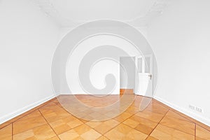 Empty room with wooden parquet floor refurbished apartment