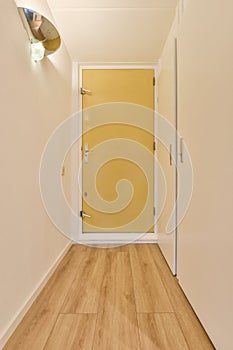 a door to a room with a wooden floor and