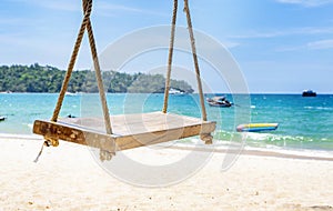 Empty rope swing at summer beach day.Joy life freedom holidays for honeymoon concept