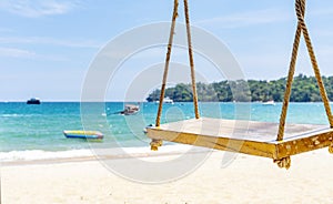Empty rope swing at summer beach day.Joy life freedom holidays for honeymoon concept