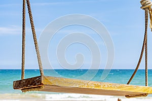 Empty rope swing at summer beach day.Joy life freedom holidays for honeymoon concept