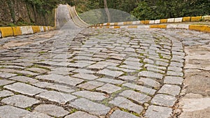 Empty rough cobblestone pavement daytime