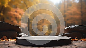 Empty round black stone podium for product display with blurred autumn forest background