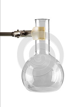 Empty round flat-bottomed laboratory flask at the foot of the tripod isolated on white