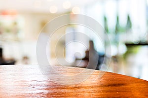 Empty round table top at coffee shop blurred background with bokeh light,Template mock up for display of your product.