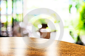 Empty round table top at coffee shop blurred background with bokeh light,Template mock up for display of your product.