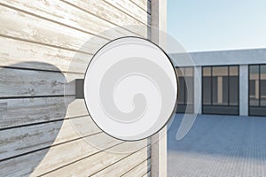 Empty round white stopper on wooden building. Bright city with sunlight background. Ad, pub, cafe, or restaurant banner. Mock up,