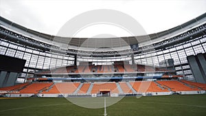 An empty rows of plastic seats in football stadium, Ekaterinburg arena, Russia. Action. Panoramic football stadium with