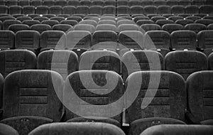 Empty rows of seats in the hall for a large number of people. Cinema and theatre hall for watching performances.