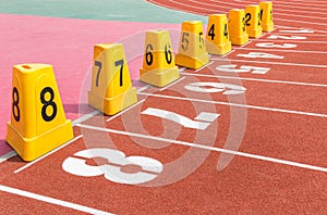 Empty running track with lane numbers.