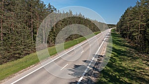 Empty Rural Highway among Forest with No Cars on It