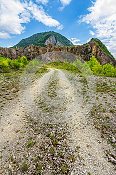 Empty rural road through rugged terrain