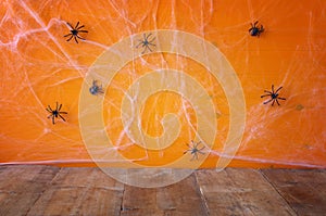 Empty rustic floor in front of spider web background