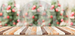 Empty rustic wood plank table top with abstract blur christmas t