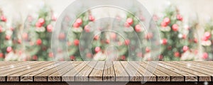 Empty rustic wood plank table top with abstract blur christmas t