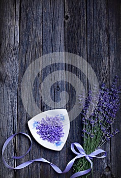 Empty rustic wooden background with purple lavender flowers