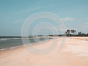 Empty sandy tropical beach. wide beach on island. copy space provided.