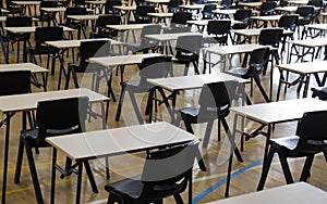 empty School or University examination tables set up in a hall